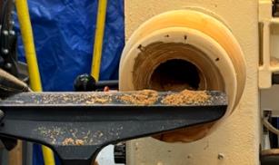 Hollowing underway — view through the lathe shield