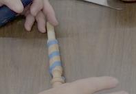 Taped finial with barber pole stripe layout