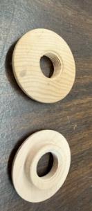 Two inserts showing the hollowed bore and threaded interior